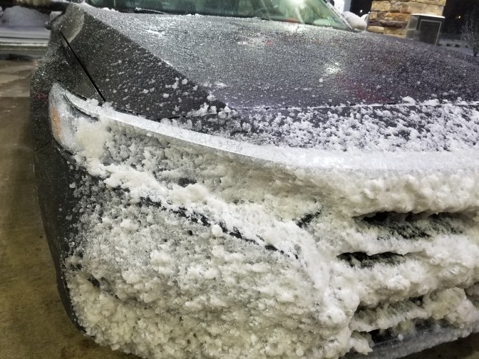 2018 Honda Accord headlights covered in snow.