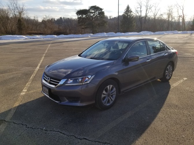 2014 Honda Accord sedan parked in parking lot.