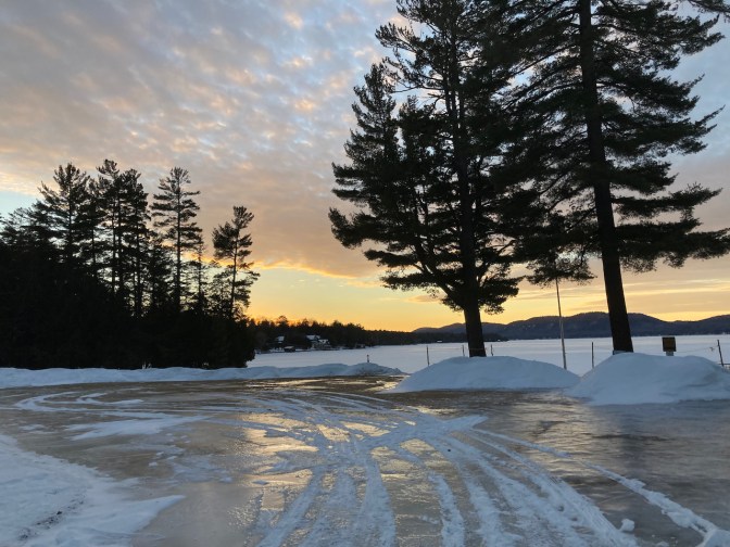 Ice-covered parking lot in park.
