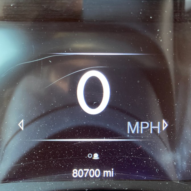 Car odometer reading 80700 miles.