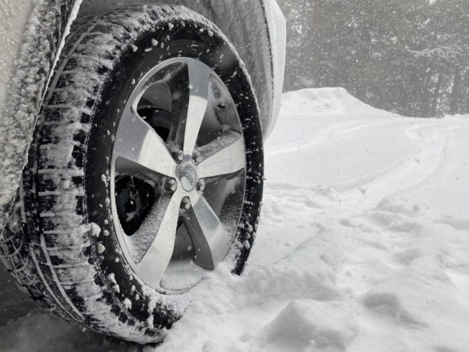 Jeep Grand Cherokee wheel with Nokian tires, in snow.