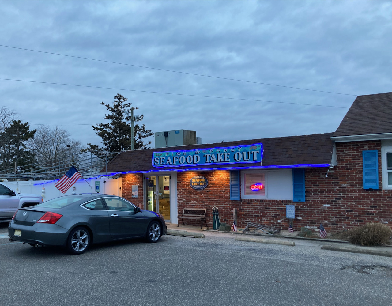 2012 Honda Accord parked in front of Fish & Fancy Seafood Take Out.