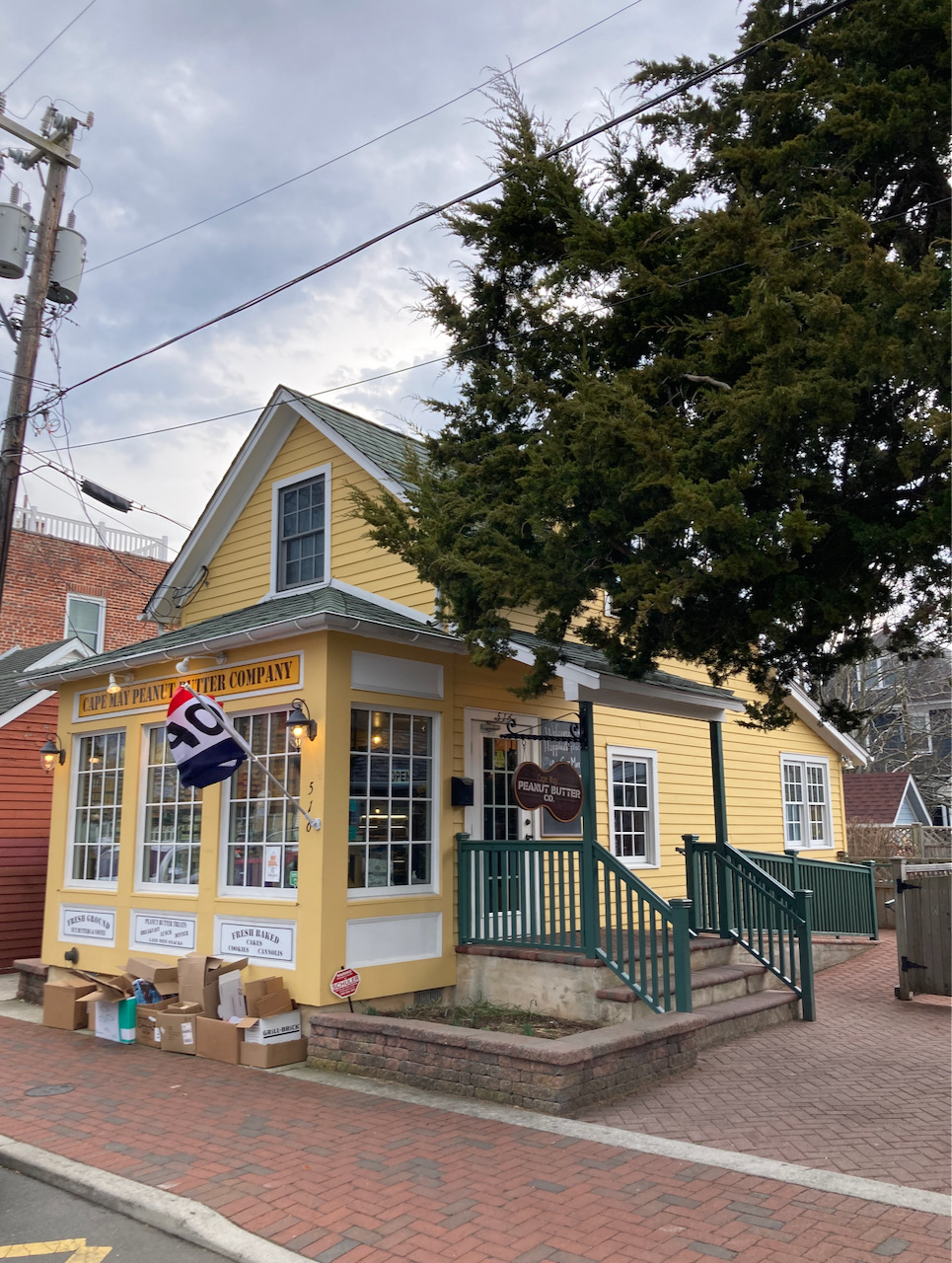Yellow building with sign on front that says CAPE MAY PEANUT BUTTER COMPANY.