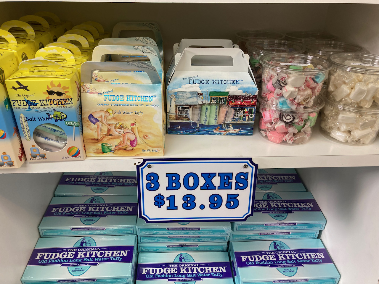 Boxes of salt water taffy on shelves.
