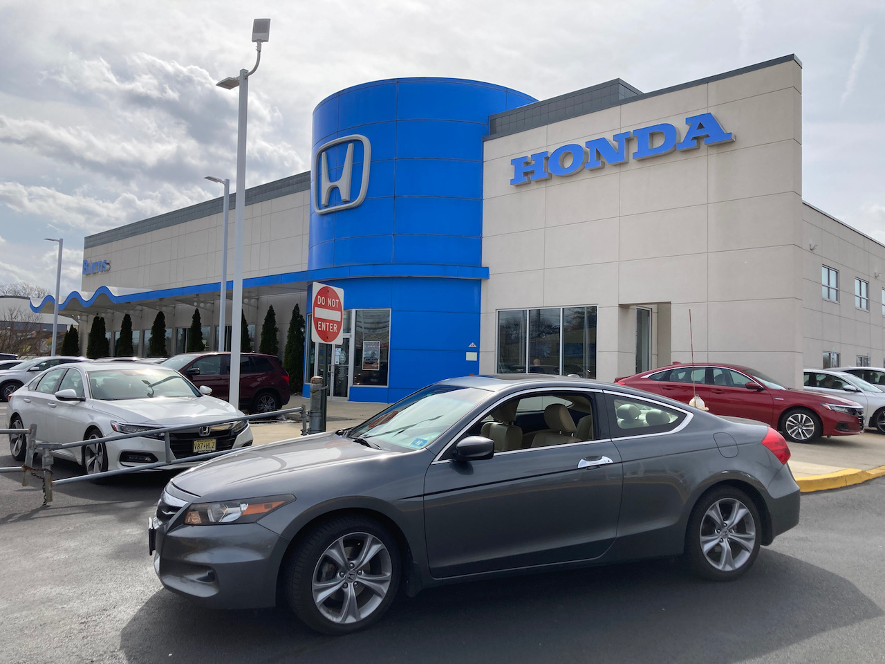 2012 Honda Accord coupe parked in front of Burns Honda.