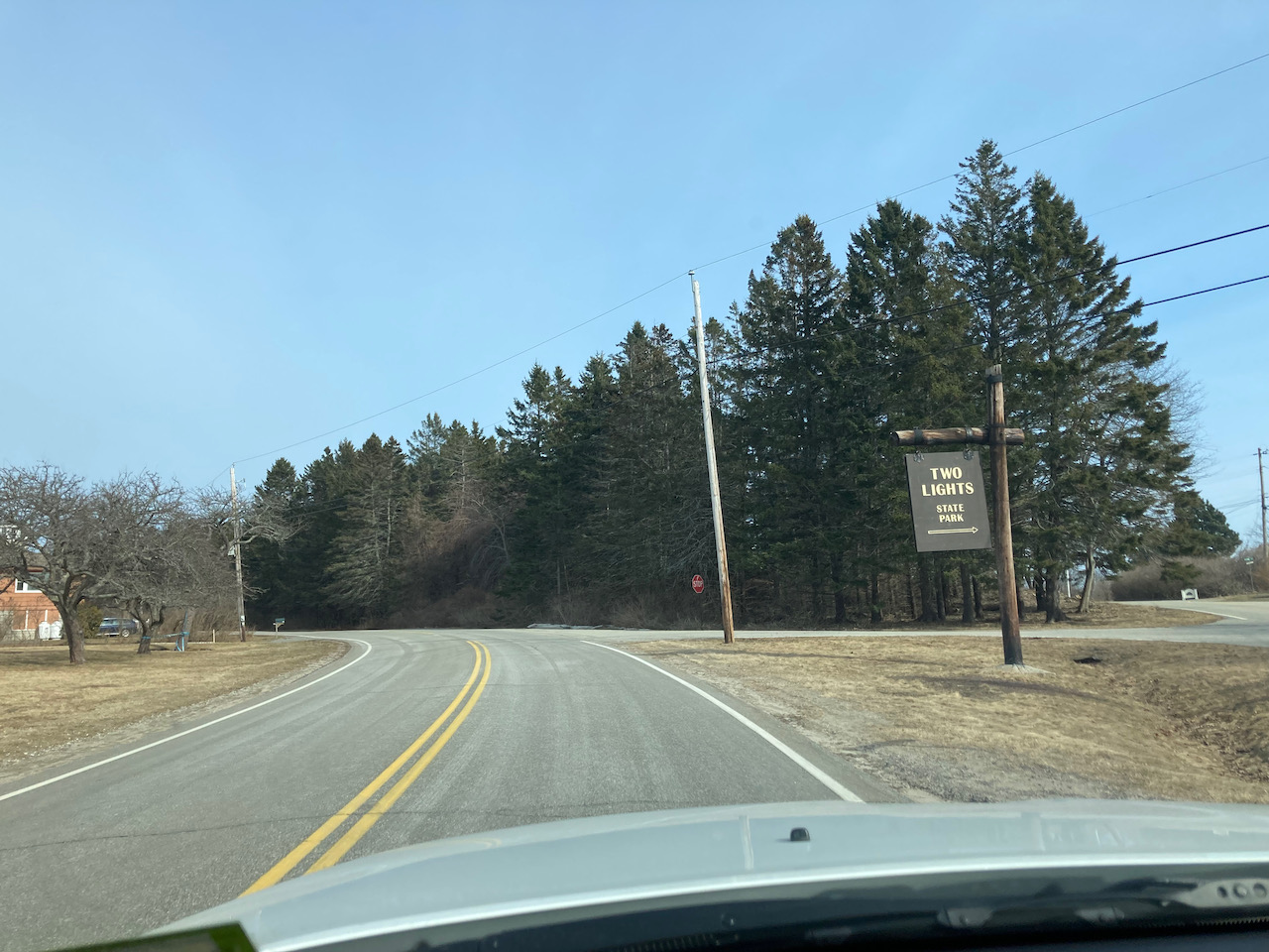 Two Lights State Park entrance sign along road.