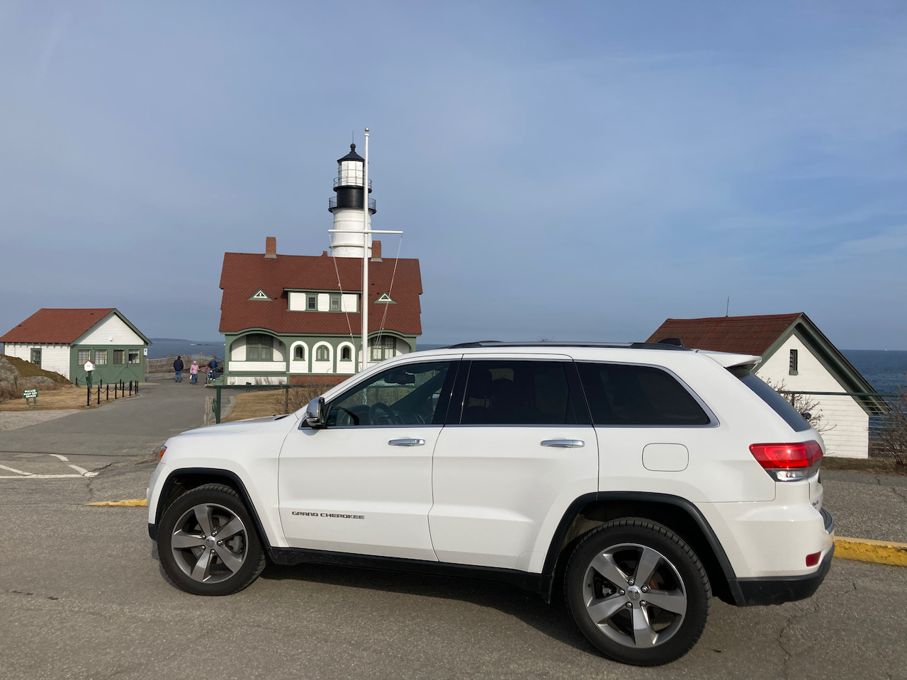 2014 Jeep Grand Cherokee parked in front of Portland Head Light.