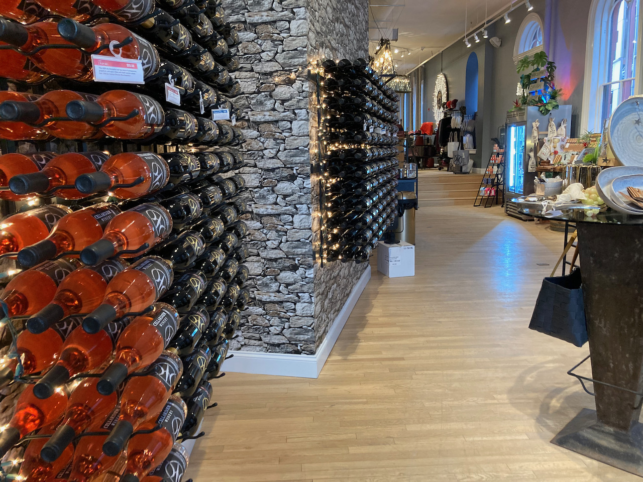 Interior of wine bar, with racks of wine on wall to left.