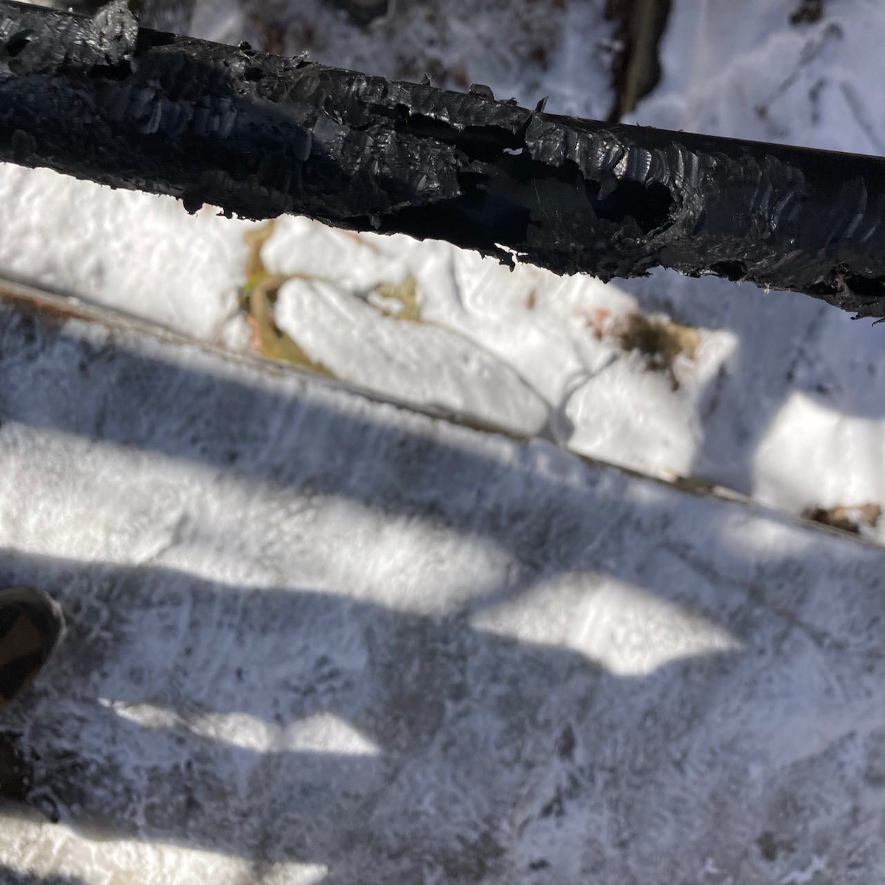 Plastic tube that has been chewed apart.