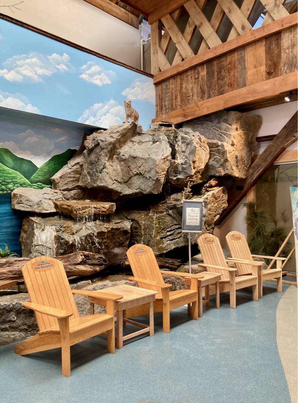 Waterfall and adirondack chairs in rest stop.