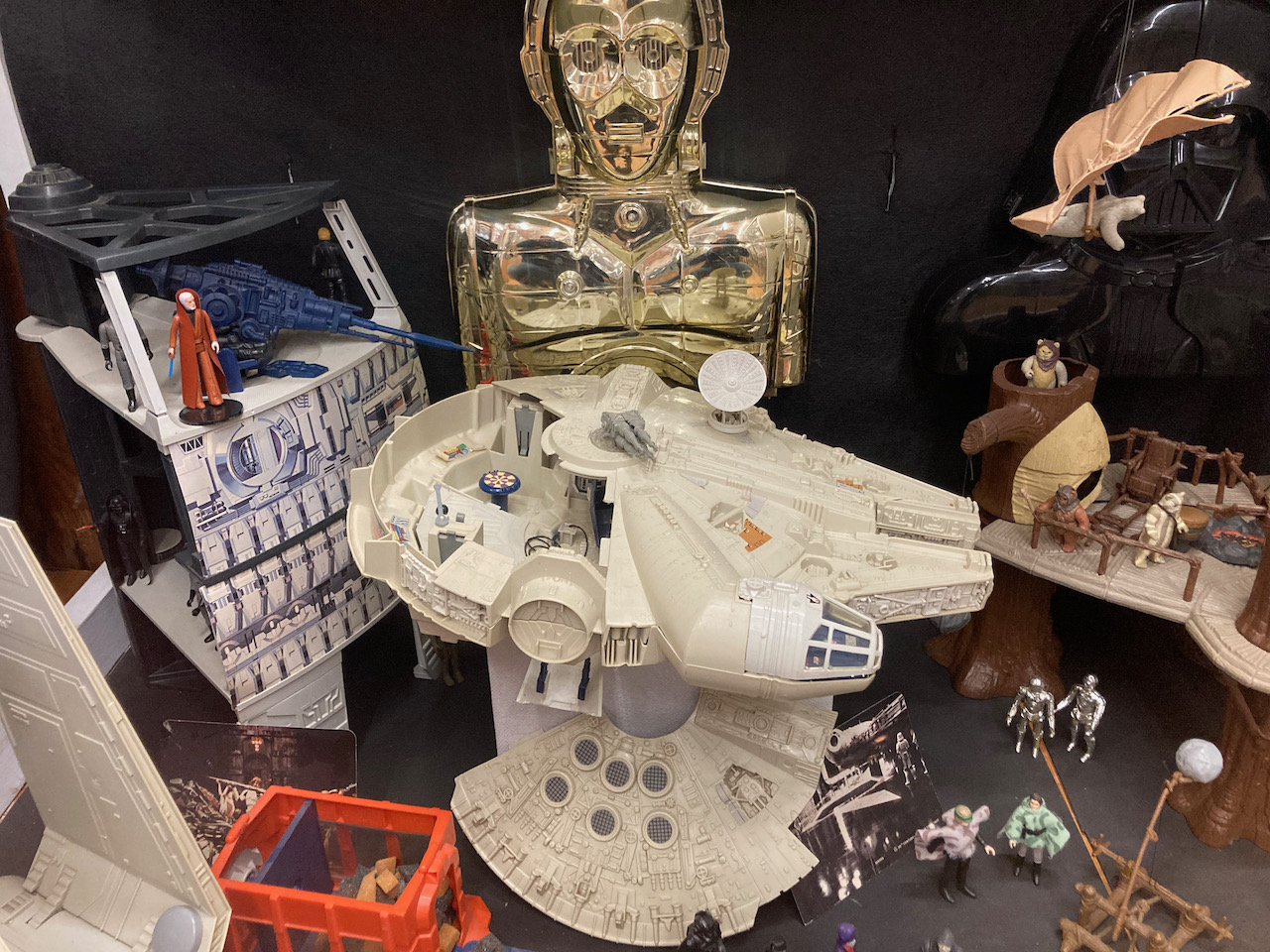 Collection of Star Wars toys, including Millennium Falcon.