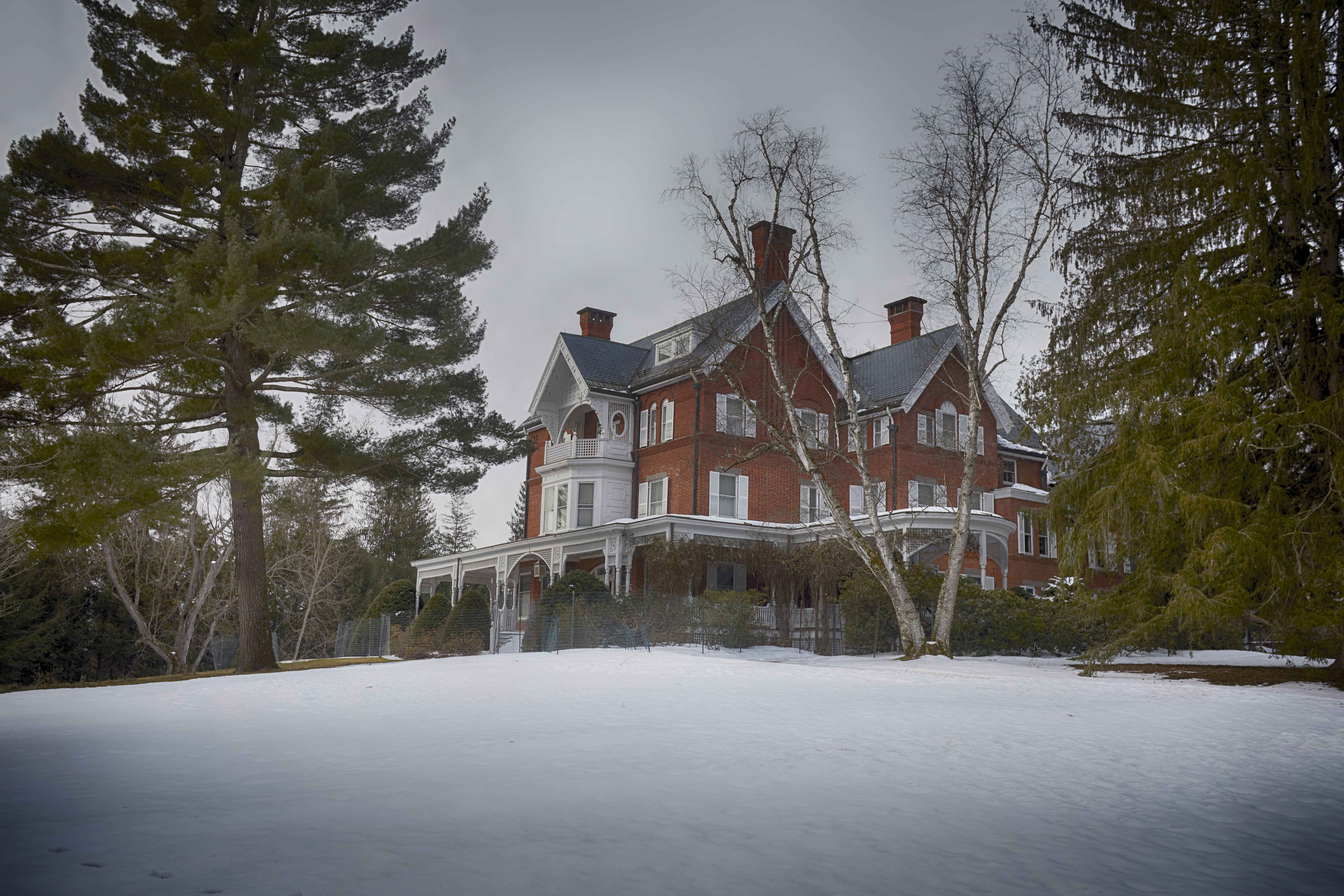 Marsh-Billings Mansion with snow-covered lawn.