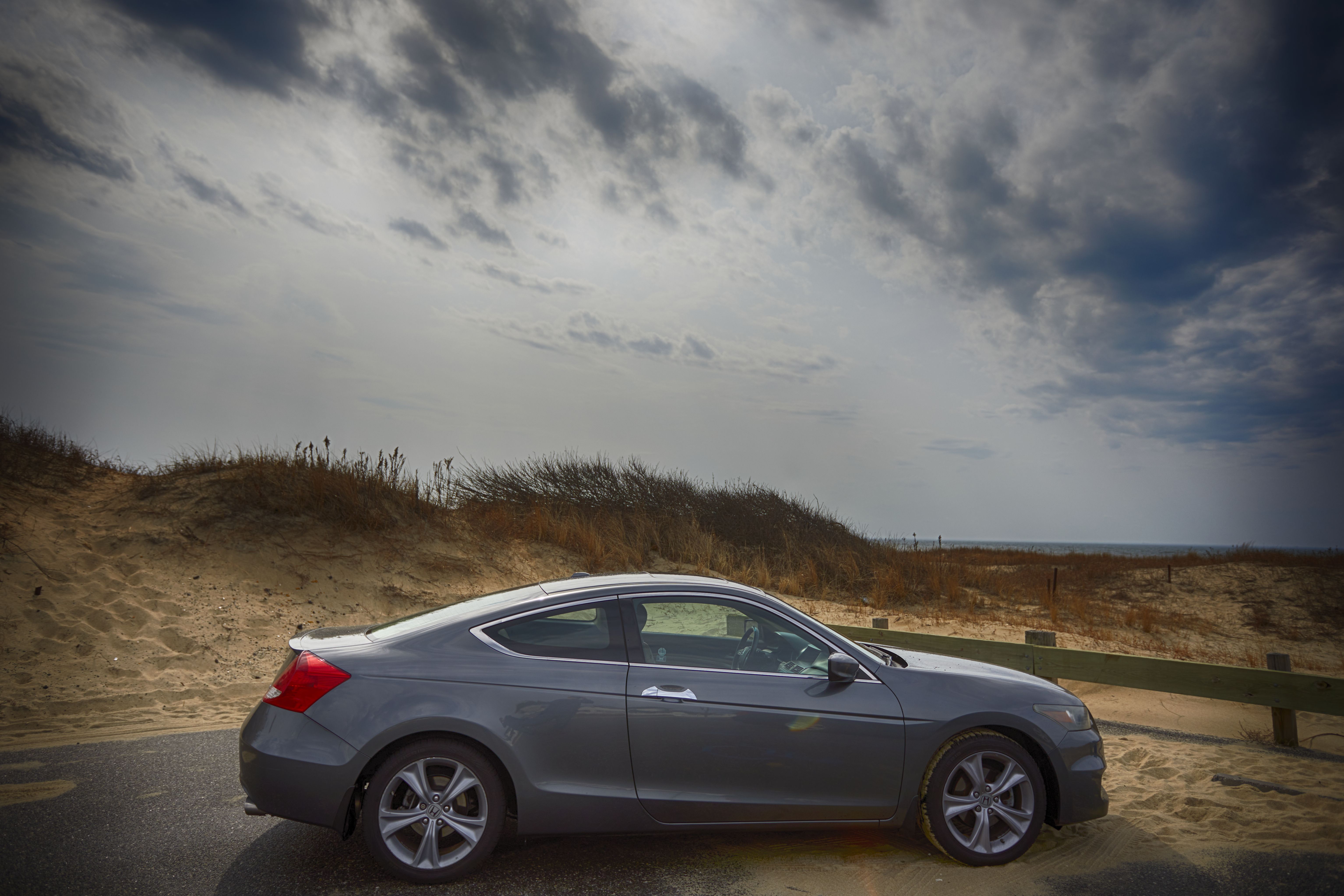 2012 Honda Accord parked in front of sand dune.