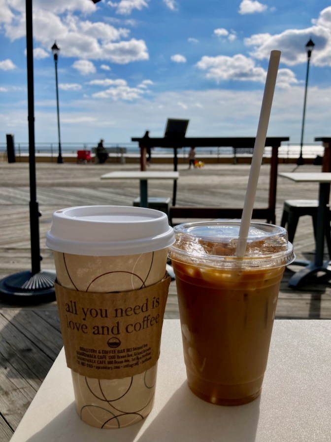 Coffee and iced coffee on table.