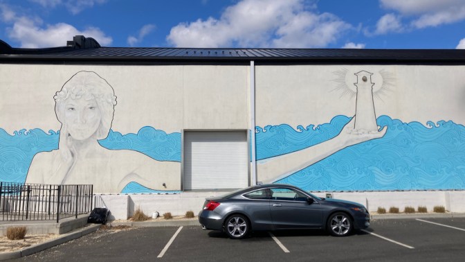 2012 Honda Accord in front of mural of woman holding lighthouse.