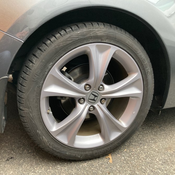 Rear wheel arch of 2012 Honda Accord.