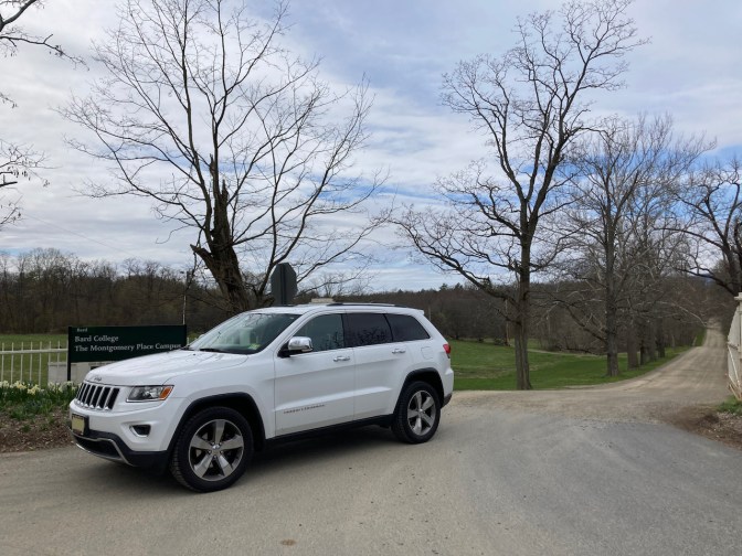 2014 Jeep Grand Cherokee parked at entrance to The Montgomery Place Campus.