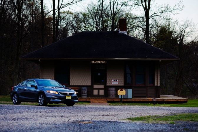 2012 Honda Accord parked in front of train station.