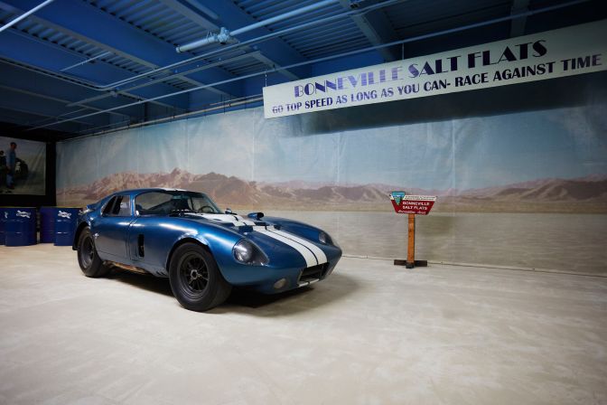 1964 Shelby Cobra Daytona Coupe in front of exhibit about Bonneville Salt Flats.