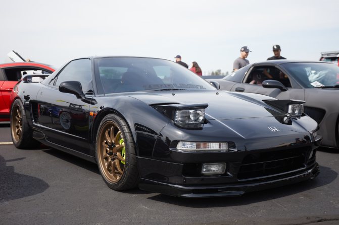Black Acura NSX with bronze wheels.