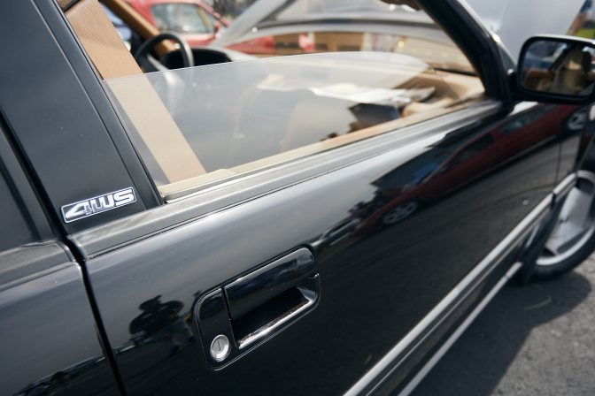 Side of Honda Prelude, with 4WS badge on window sill.