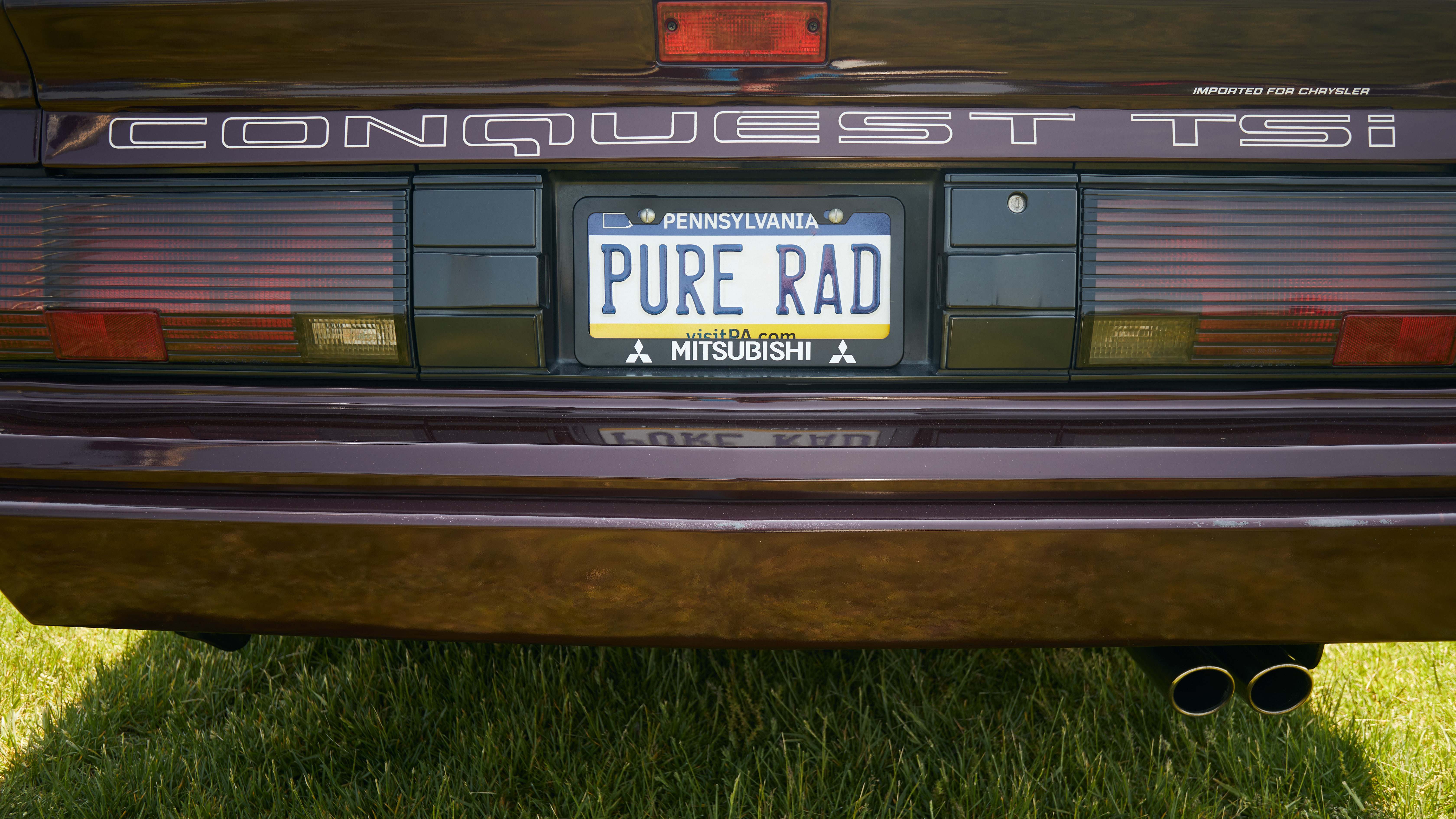 License plate on Chrysler Conquest that says PURE RAD.