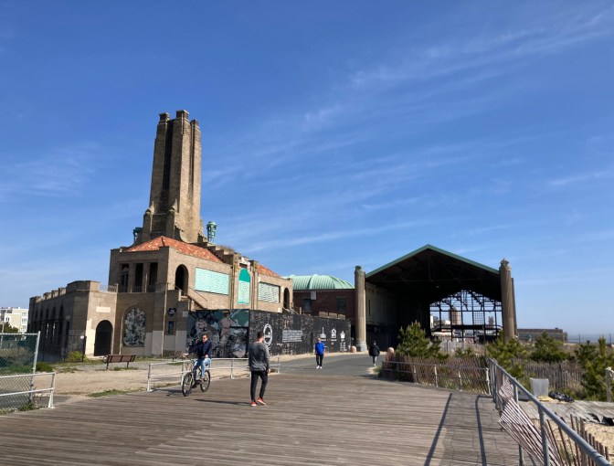 Boardwalk, with remains of casino and Asbury Park steam plant in background.