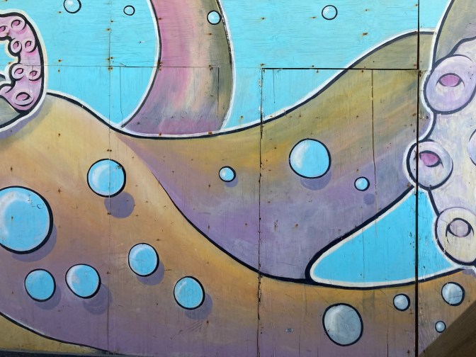 Octopus mural on wall.