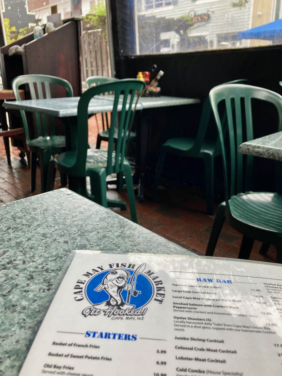 Menu for Cape May Fish Market on table on patio of restaurant.