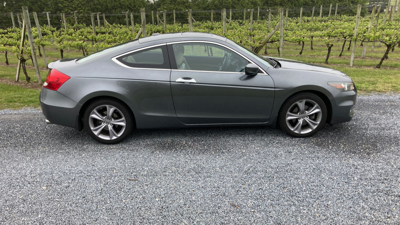 2012 Honda Accord parked in front of vineyard.