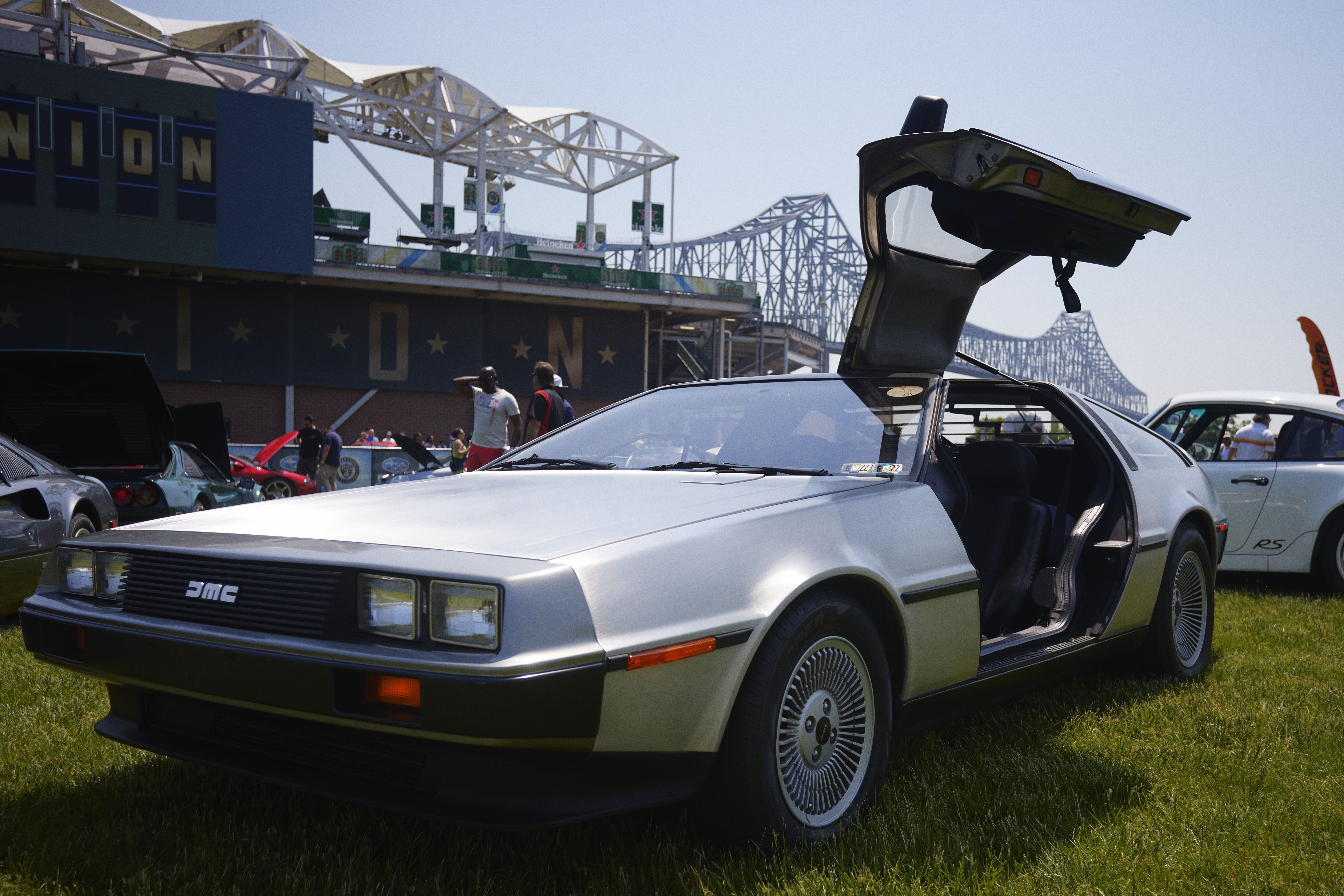 DeLorean DMC with gull wing door open.