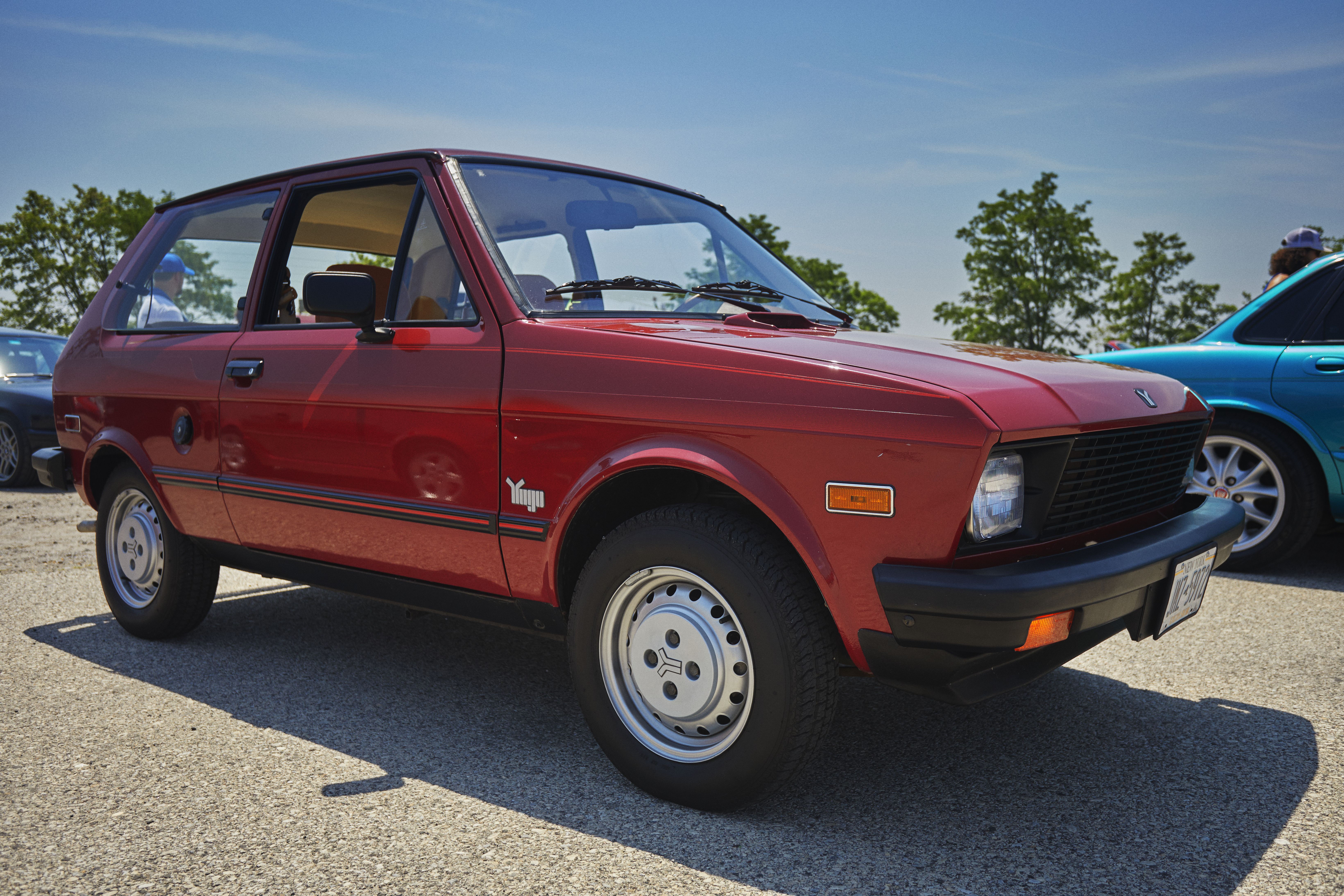 Red Yugo hatchback.