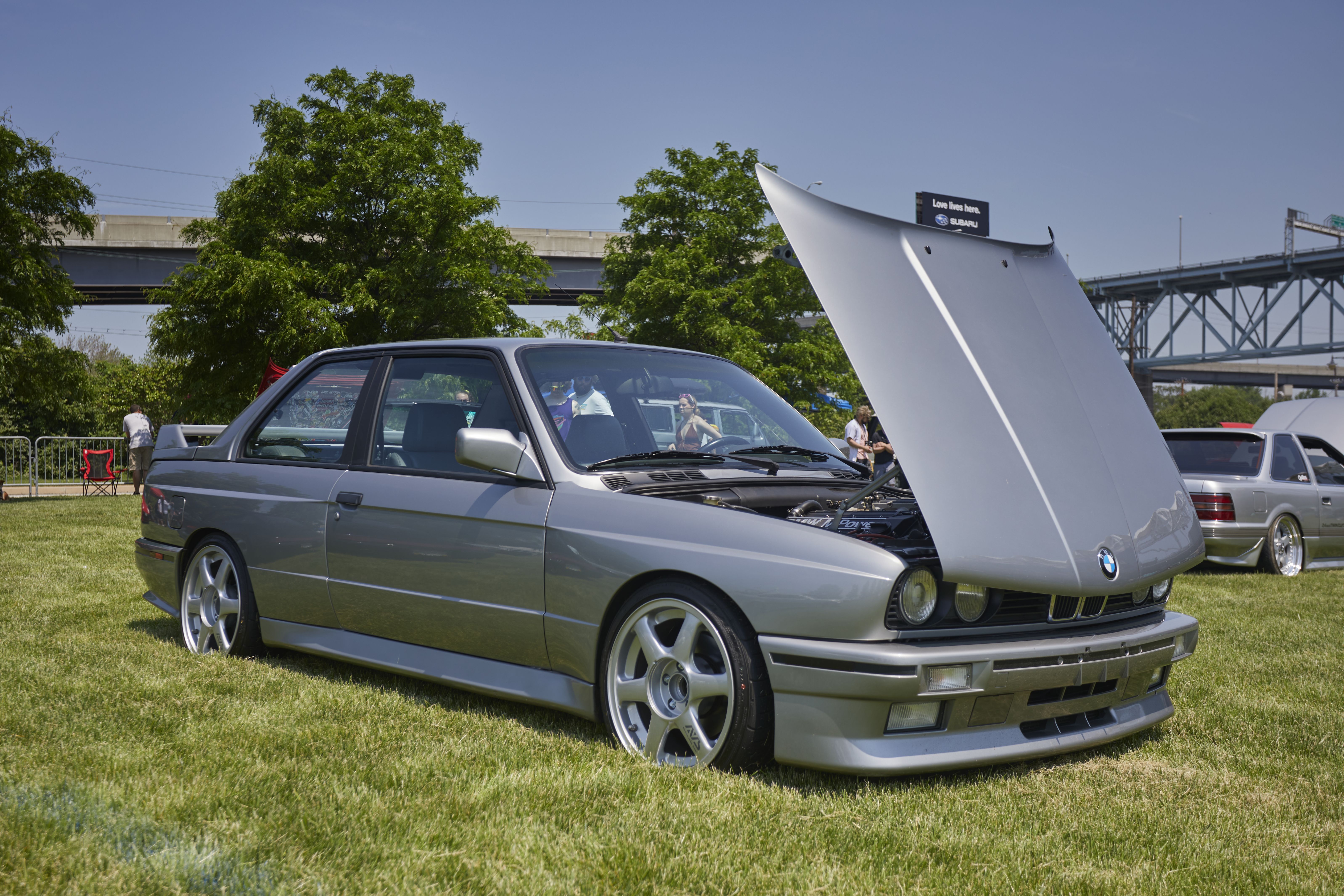 Silver BMW M3 with hood up.