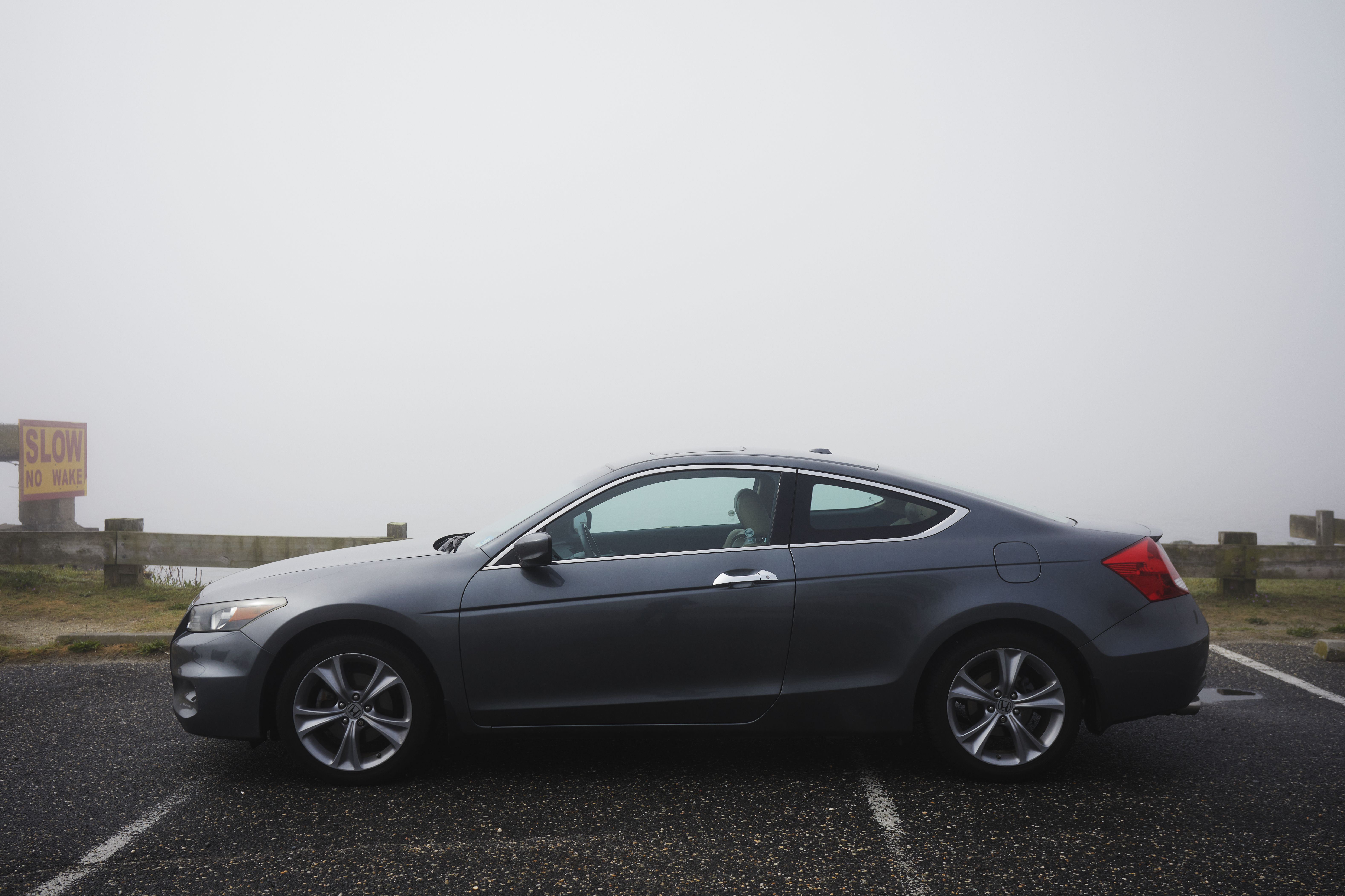 2012 Honda Accord, parked in front of canal. A thick fog hangs in the background.