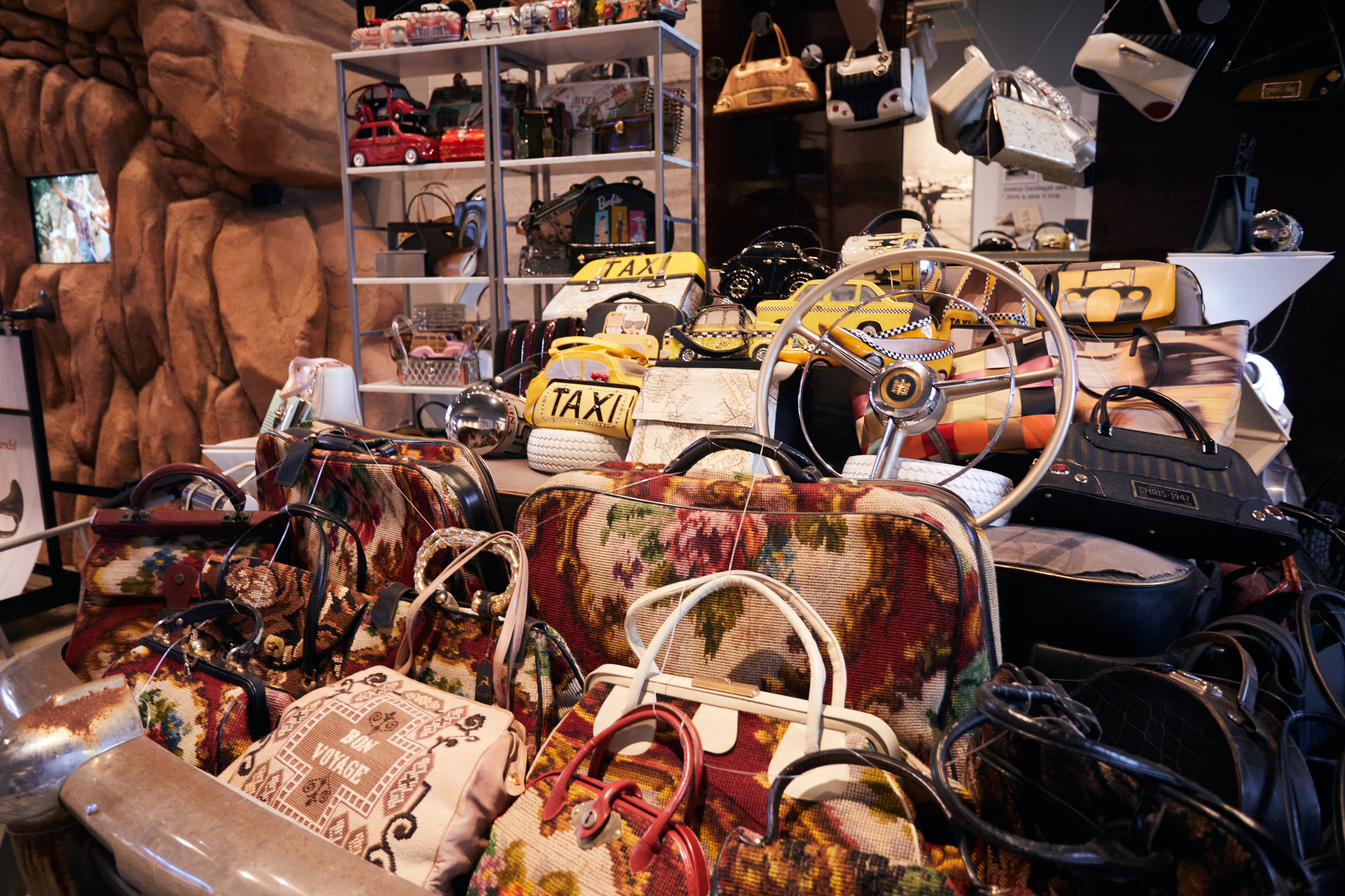 Collection of automotive-themed purses.