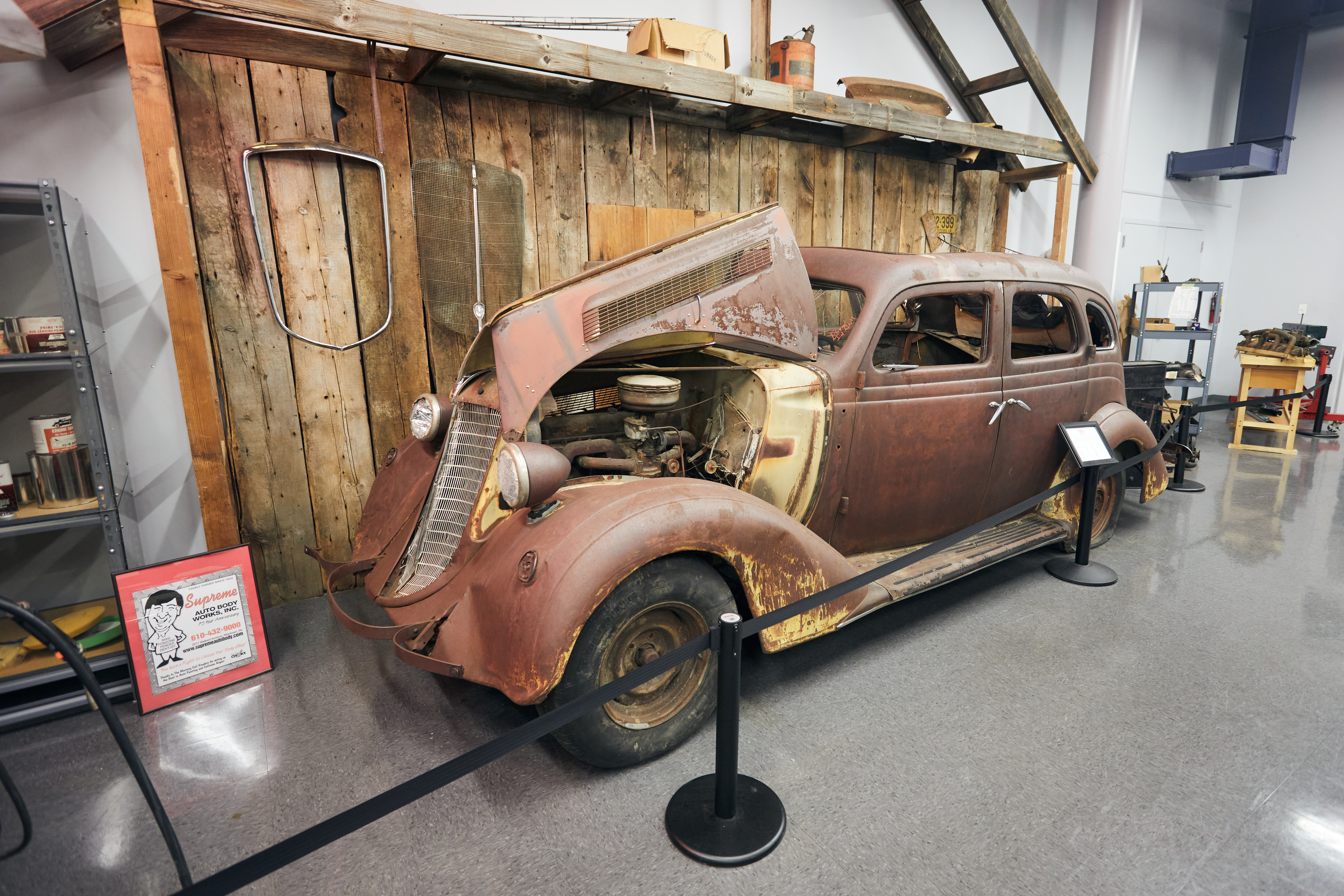 1930s car on display in restoration shop.