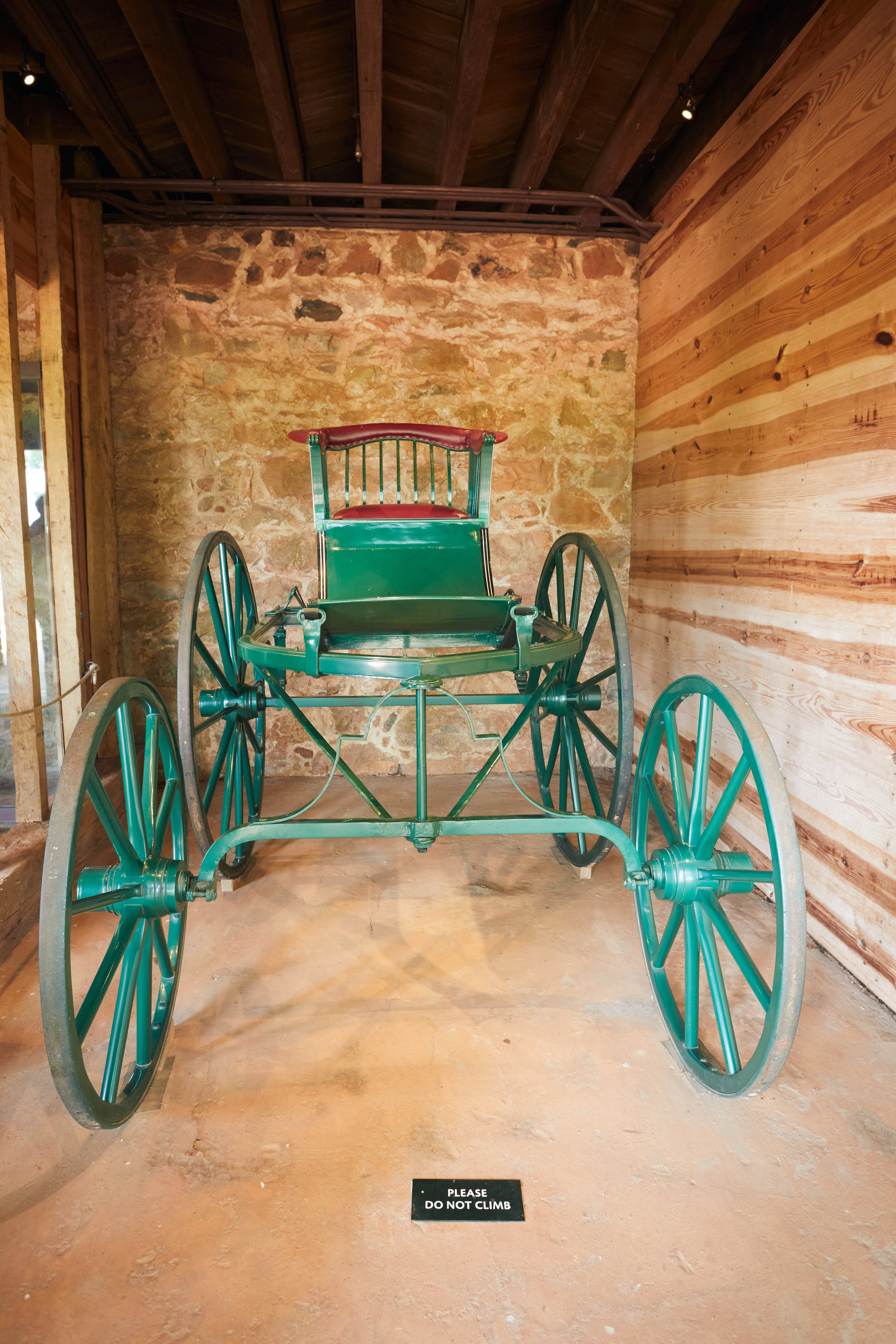Buggy on display beneath house.
