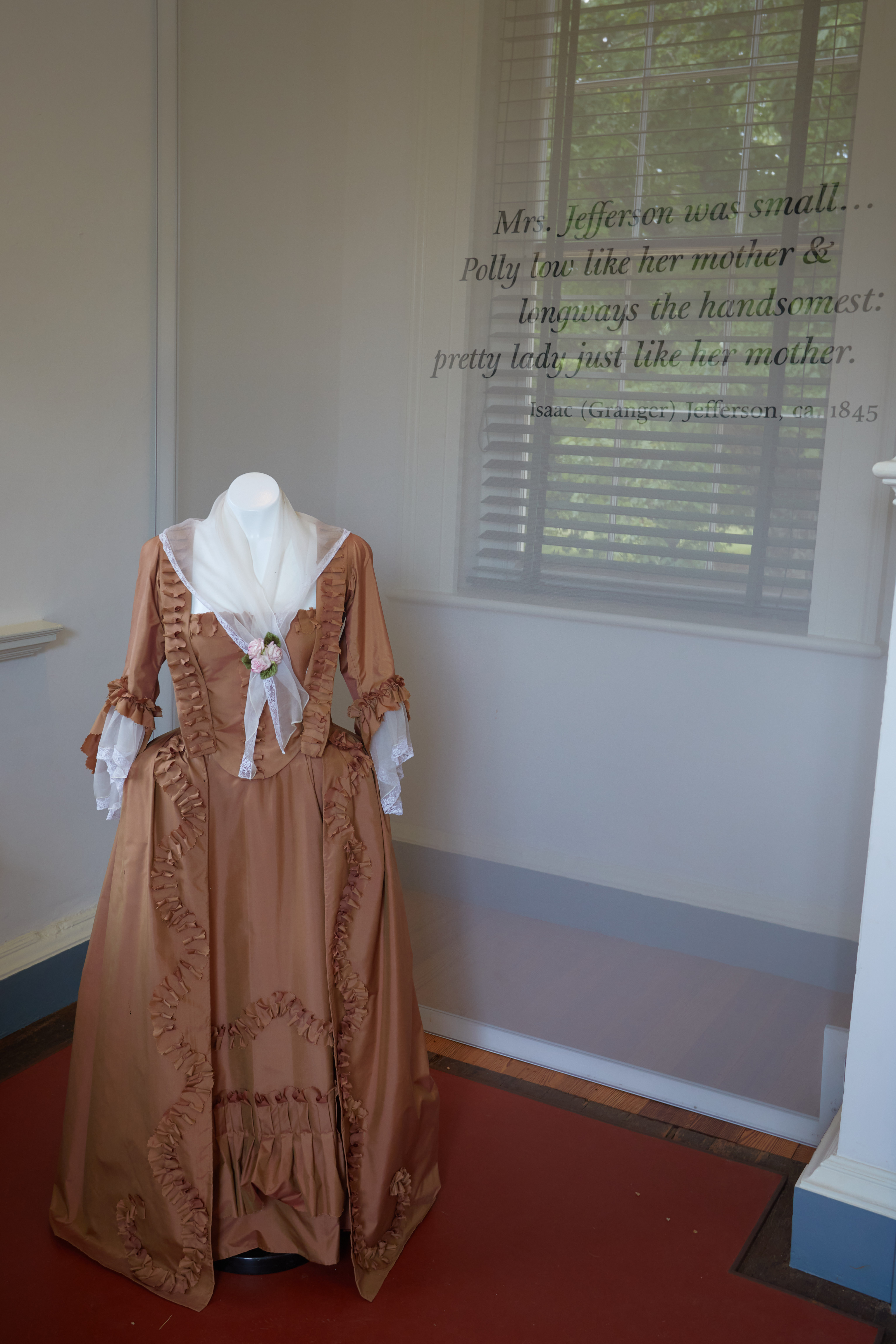Room with Martha Jefferson's dress on display.