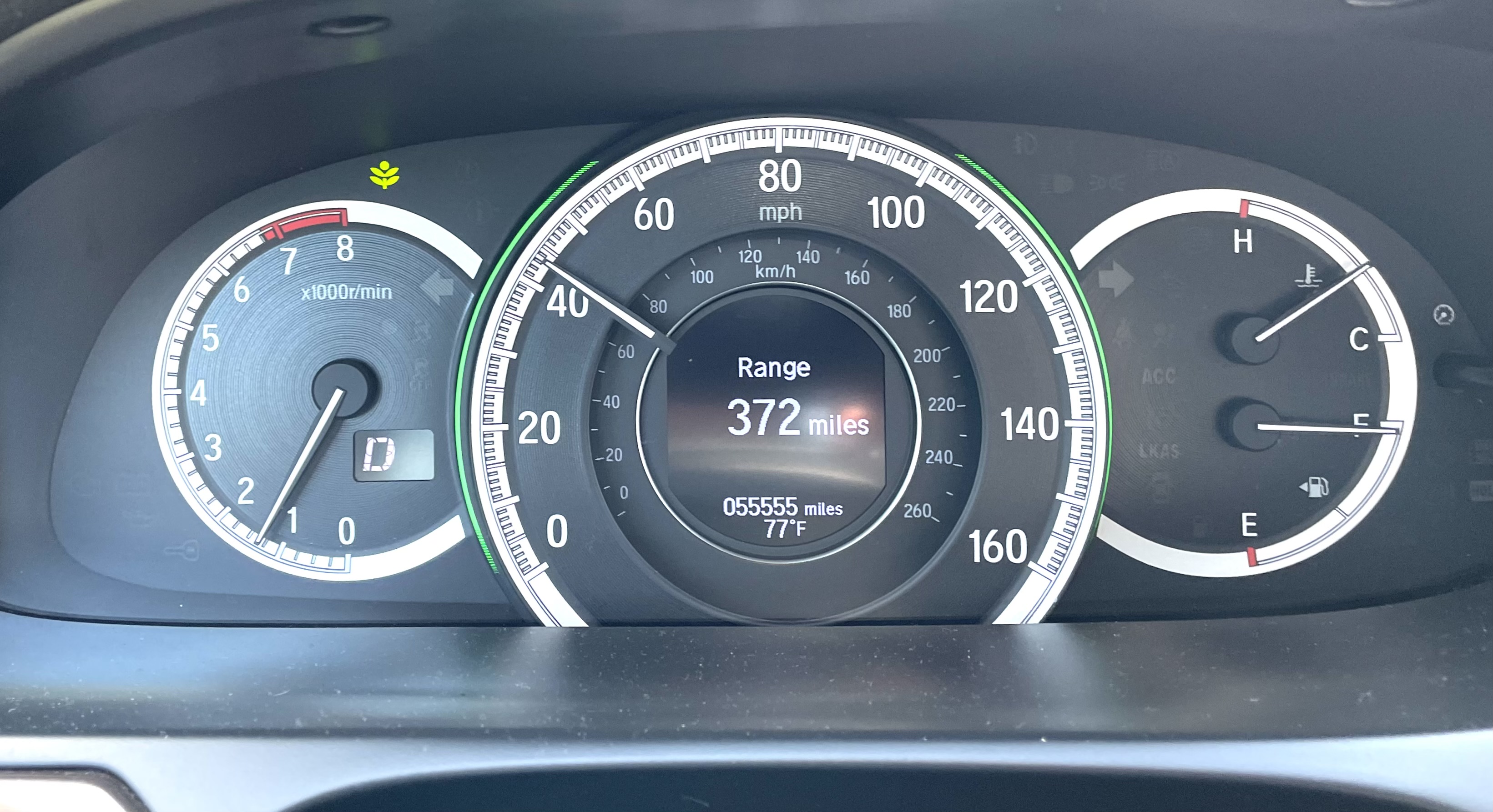 Car odometer reading 55555 miles.