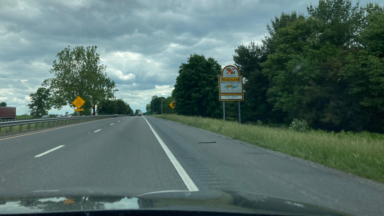 Roadside sign that says MARYLAND WELCOMES YOU