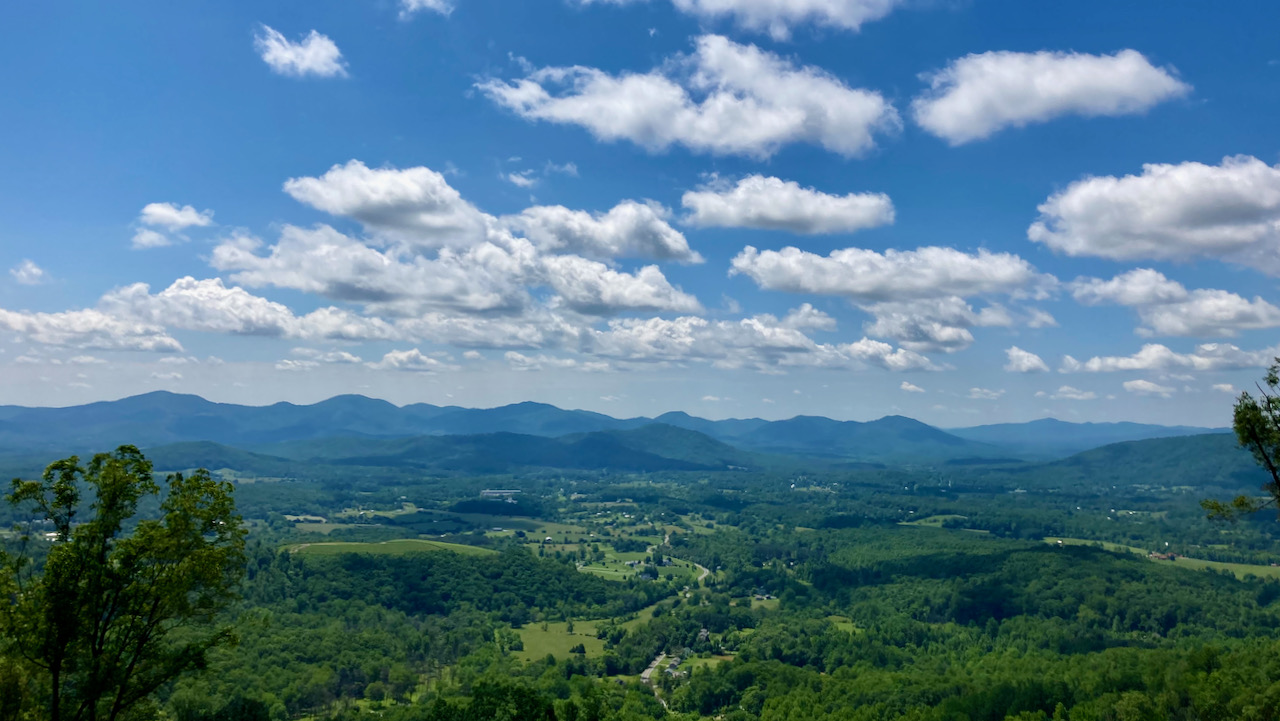 View of mountains and countryside on a sunny day.