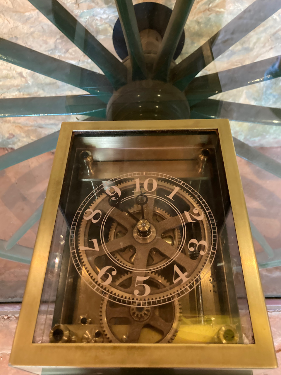 Gear and clock-style odometer beside wagon wheel.