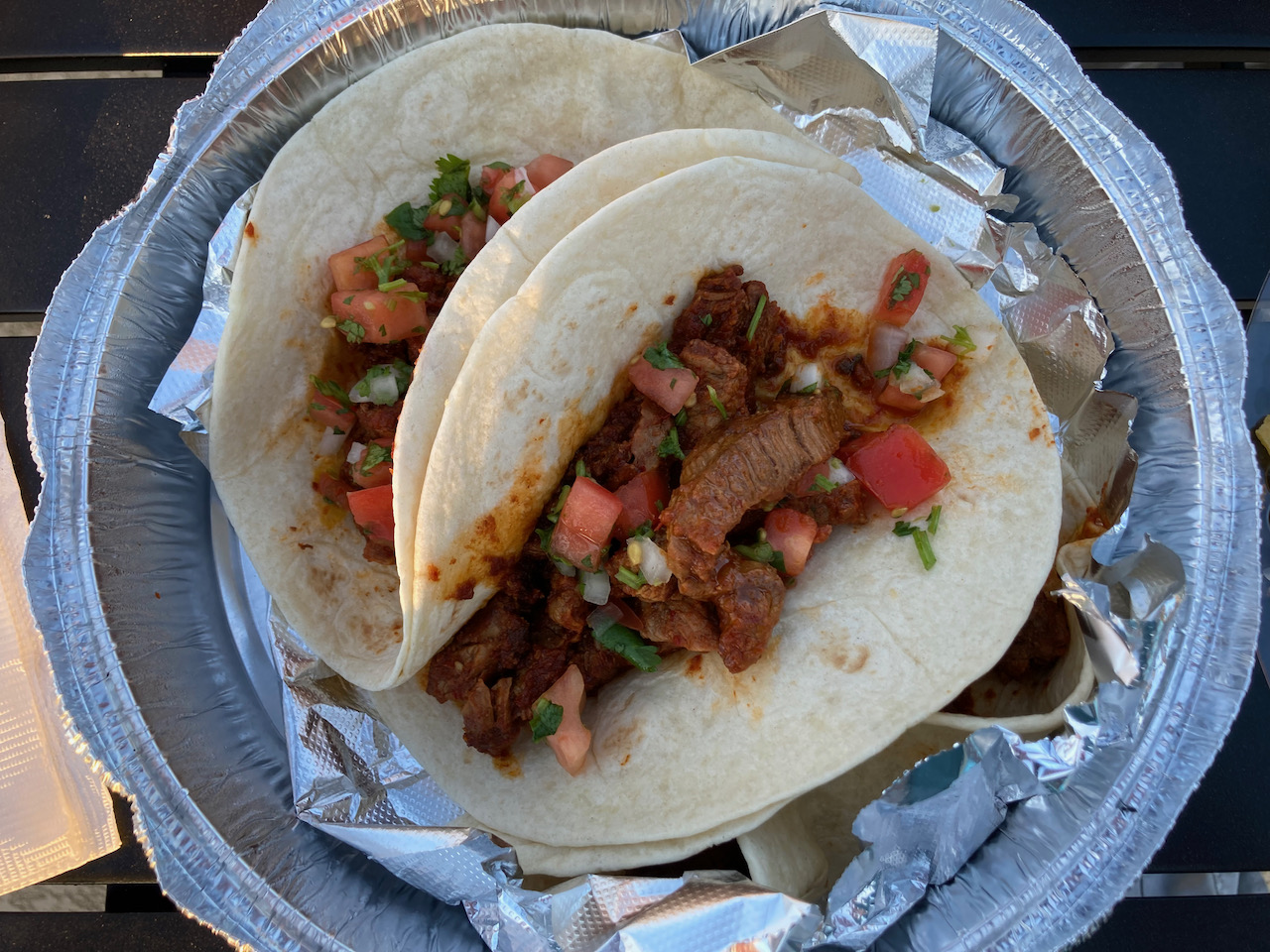 Tacos in takeout container.