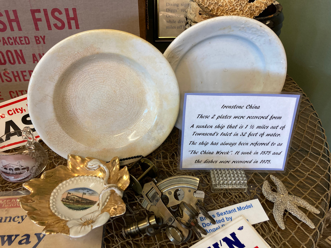 Display of plates pulled from shipwreck.