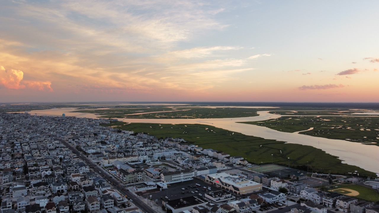 Airborne view of Sea Isle City, facing southwest, with wetlands and channels in distance.
