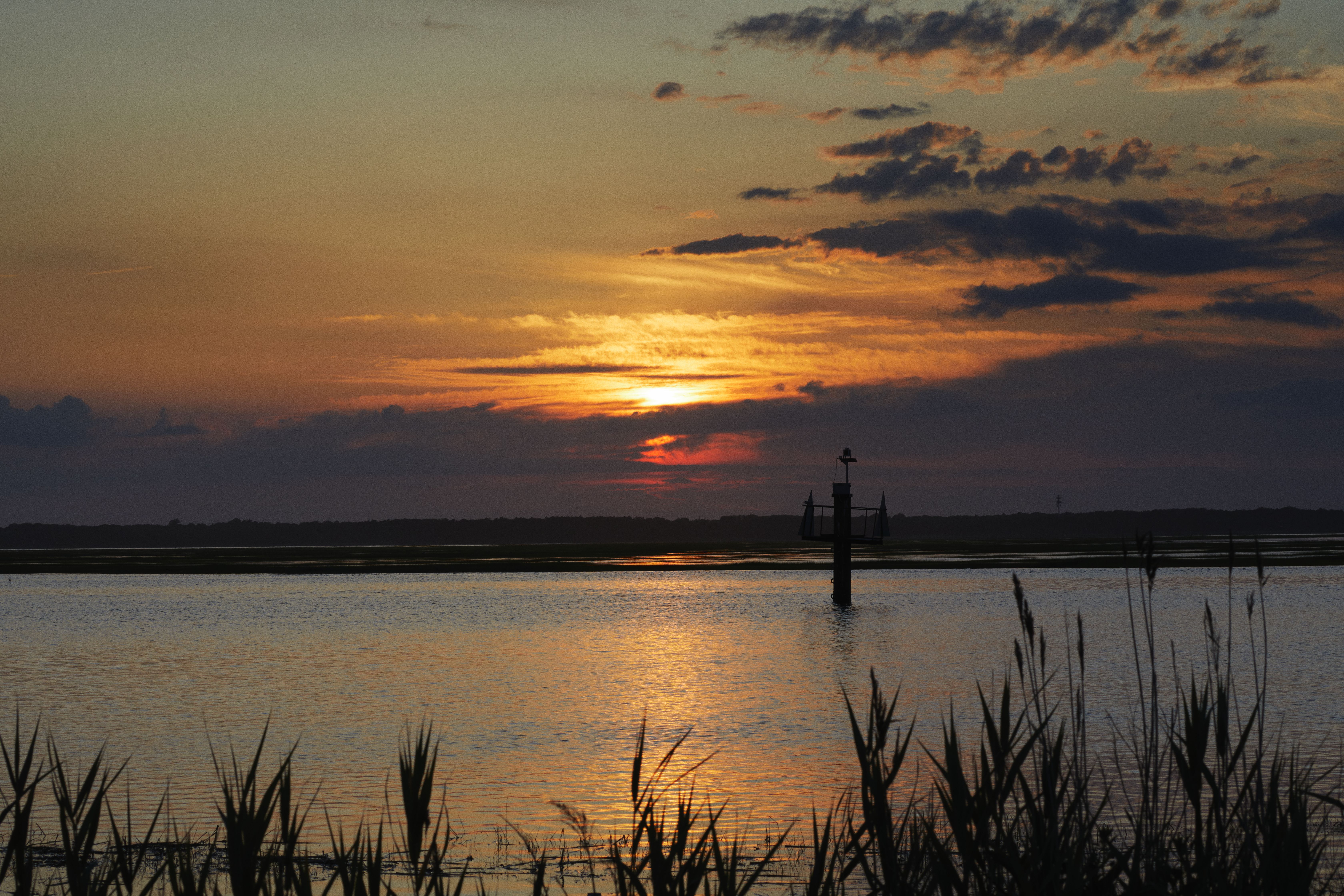 Sunset over channels and wetlands on western side of Sea Isle City.