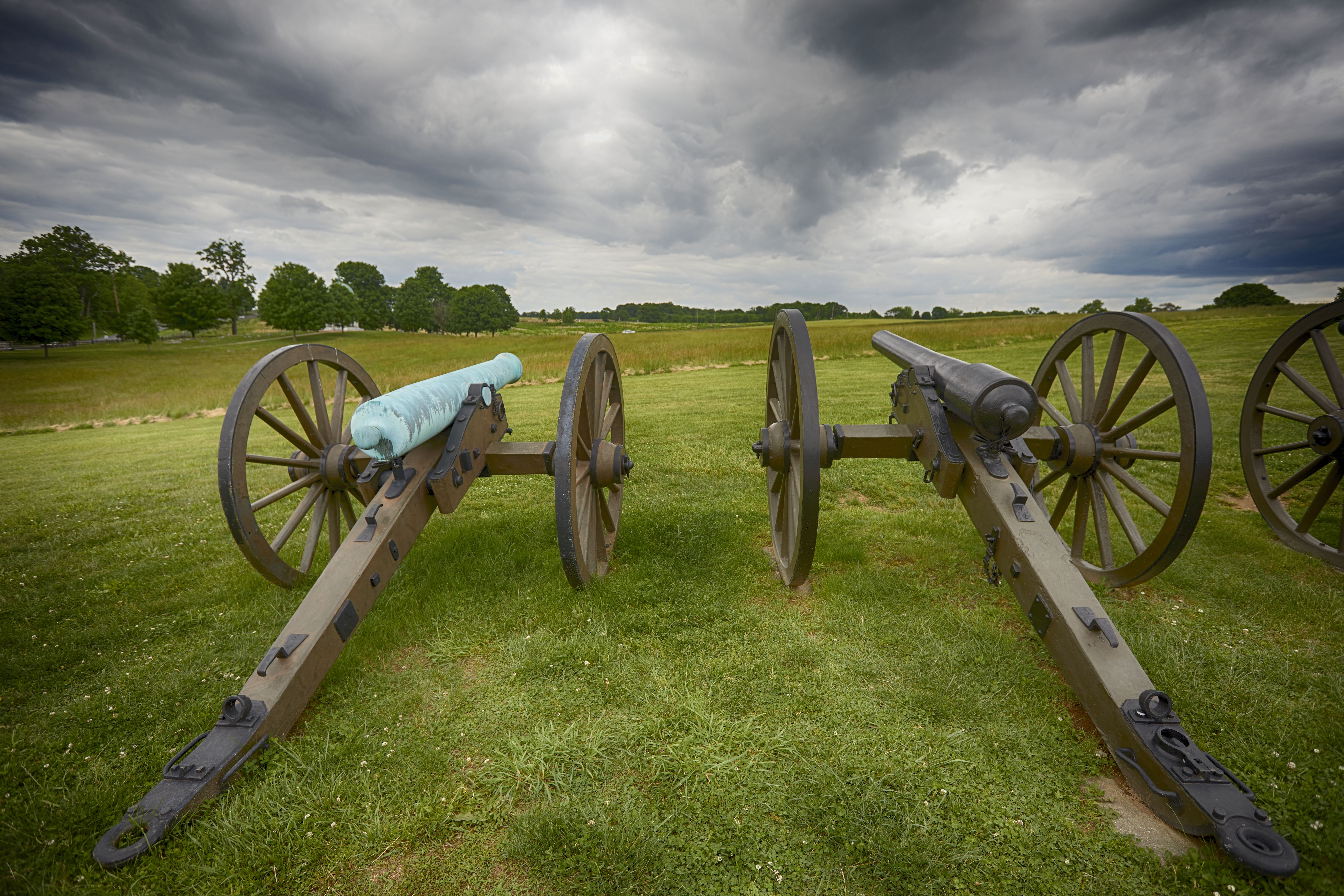 Two cannons in field.