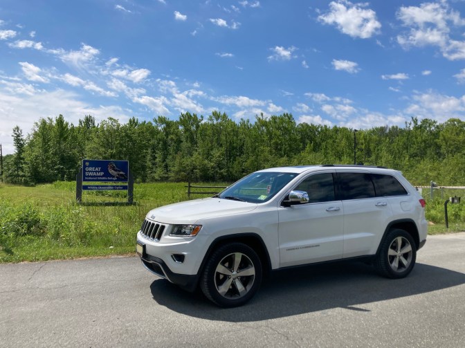 2014 Jeep Grand Cherokee parked at entrance to Great Swamp.