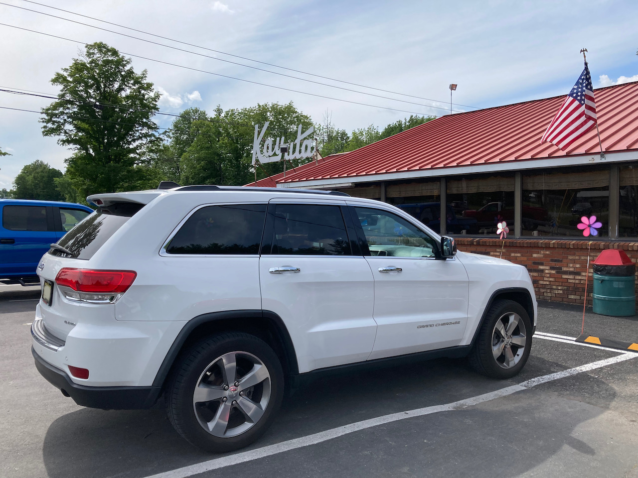 2014 Jeep Grand Cherokee parked in front of KAYUTA Diner.