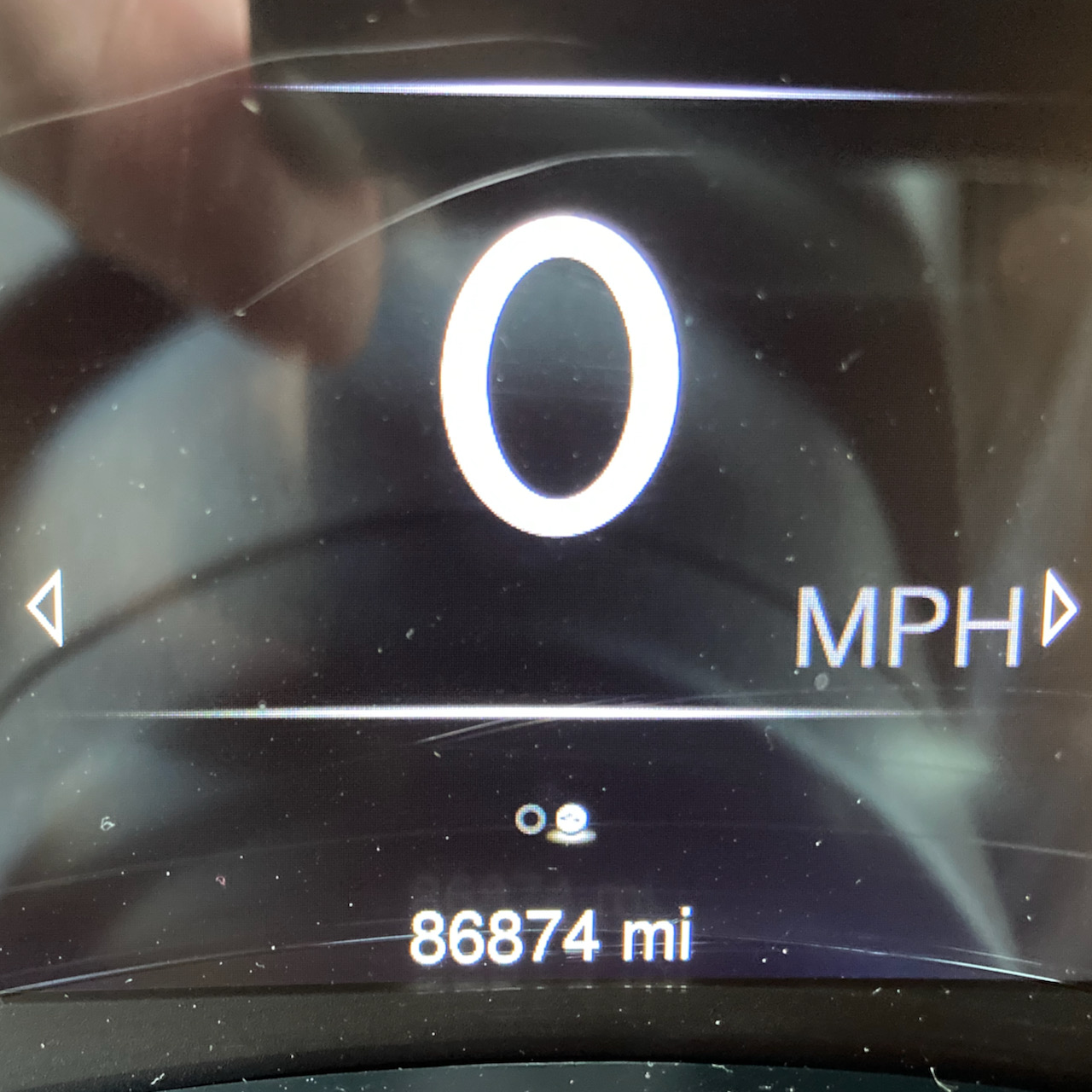Car odometer reading 86874 miles.